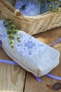 Sachet with ukrainian embroidery, sheaf of wheat and dried herbs on wooden background Royalty Free Stock Photo