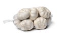 Sack with dried garlic bulbs close up on white background Royalty Free Stock Photo