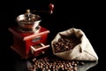 Sack full of coffee beans with mill Royalty Free Stock Photo