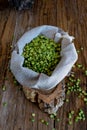 Sack of split peas on wooden table