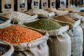 Sacks filled with colorful legumes beautifully displayed at a market, offering variety and healthful options