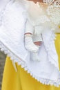 The sacrament of baptism. Baby clothes for the christening. Newborn baby during christening and chrismation