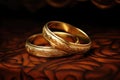 Sacrament: Matrimony. Wedding rings on a brown background. Closeup shot. Royalty Free Stock Photo