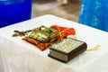 The sacrament of the rite baptism of a child in an Orthodox Christian church. Chan for ablution and altar with a bible Royalty Free Stock Photo