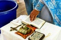 The sacrament of the rite baptism of a child in an Orthodox Christian church. Chan for ablution and altar with a bible Royalty Free Stock Photo