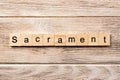 Sacrament word written on wood block. sacrament text on table, concept Royalty Free Stock Photo