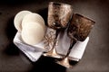 Sacramental bread and silver chalice cups Royalty Free Stock Photo