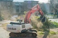 Excavators working on chopping the trees