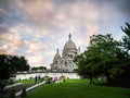 Sacre Coeur as seen from below with dramatic evening clouds in background