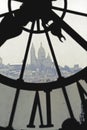 Sacre-Coeur viewed through clock tower in Museum Orsay in Paris
