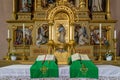 Sacred altar with wood carved Jesus Christ standing at the door