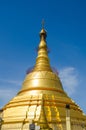 Sacred Bo Ta Tuang pagoda with blue sky background.