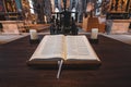 The sacred book is opened on the altars of the ancient Gothic Catholic cathedral of Nuremberg, Germany