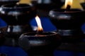 Sacred fire, coconut oil lamps in a buddhist temple Royalty Free Stock Photo