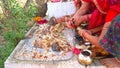 Sacred food with milk holding on Hindu god statue. Delicious Parsad for Hindu goddess Shilta Mata