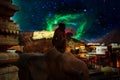 Sacred monkey on background of cosmic starry sky in ancient city