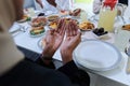 In the sacred month of Ramadan, a diverse Muslim family comes together in spiritual unity, fervently praying to God