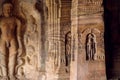 Sacred place of Jainism, reliefs of meditating men inside the 7th century cave temple, in town Badami, India