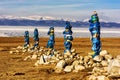 Sacred place with obo. Winter landscape of Mongolia. Lake Khubsugul and mountain