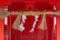 Sacred rope, or shimenawa, and shide, paper streamers, at Nomachiinari shinto shrine in Kanazawa, Japan
