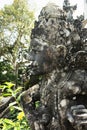 Sacred sculpture of human deity carved of stone decorate of traditional balinese sacred temple Lempuyang on Bali, vertical.