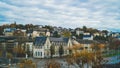 Sacred Serenity: Lourdes Cityscape Alongside a Holy River