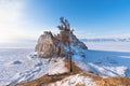 Sacred Shamanka Mountain on Olkhon Island in winter. View of the frozen Lake Baikal on a sunny day