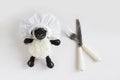 The Sacrifice Feast Concept with handmade little crocheted sheep toy