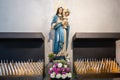 Virgin Mary with Son Jesus about sacrificial candles in Church of Bressanone, - Brixen - in Alto Adige, South Tyrol, Italy Royalty Free Stock Photo