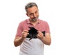 Sad adult man presenting empty wallet as no finance concept Royalty Free Stock Photo