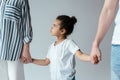 Sad african american kid holding hands with divorced foster parents Royalty Free Stock Photo