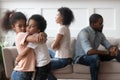 Sad african children embracing upset at parents fight at home Royalty Free Stock Photo