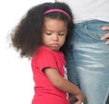 Sad afroamerican girl hugging an adult Royalty Free Stock Photo