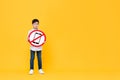 Sad Asian boy holding banned cellphone signage