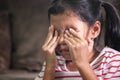 Sad asian child girl is crying and rubbing her eyes Royalty Free Stock Photo