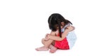 Sad asian girl barefoot sitting on floor with copy space. Isolated on white background.