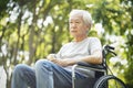 Sad asian senior man sitting in wheelchair Royalty Free Stock Photo