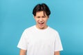 Sad Asian Teen Guy Shouting Loudly Crying Over Blue Background Royalty Free Stock Photo