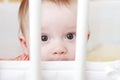 Sad baby in white bed Royalty Free Stock Photo