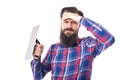 Sad bearded man holding used masonry tool