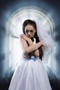 Sad bride, window ful of sunshine on background Royalty Free Stock Photo