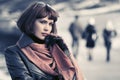 Sad beautiful fashion woman in black leather coat and brown scarf Royalty Free Stock Photo