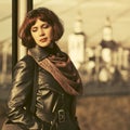 Sad beautiful fashion woman in black leather coat and brown scarf Royalty Free Stock Photo