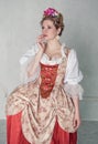 Sad beautiful woman in old-fashioned medieval dress
