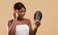 Sad Black Woman Looking To Mirror And Touching Face Suffering Skin Problems Royalty Free Stock Photo