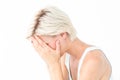 Sad blonde woman crying with head on hands Royalty Free Stock Photo