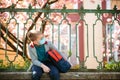 Sad boy with backpack near school fence. Schoolkid wearing safety mask. Medical mask to prevent coronavirus Royalty Free Stock Photo