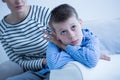 Sad boy and his mom Royalty Free Stock Photo