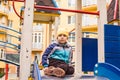 Sad boy play alone at playground outdoors Royalty Free Stock Photo