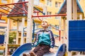 Sad boy play alone at playground outdoors Royalty Free Stock Photo